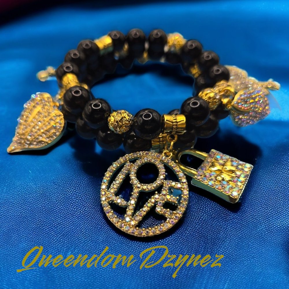 10MM Onyx black grade AA beaded memory wire bracelet with gold bling charms